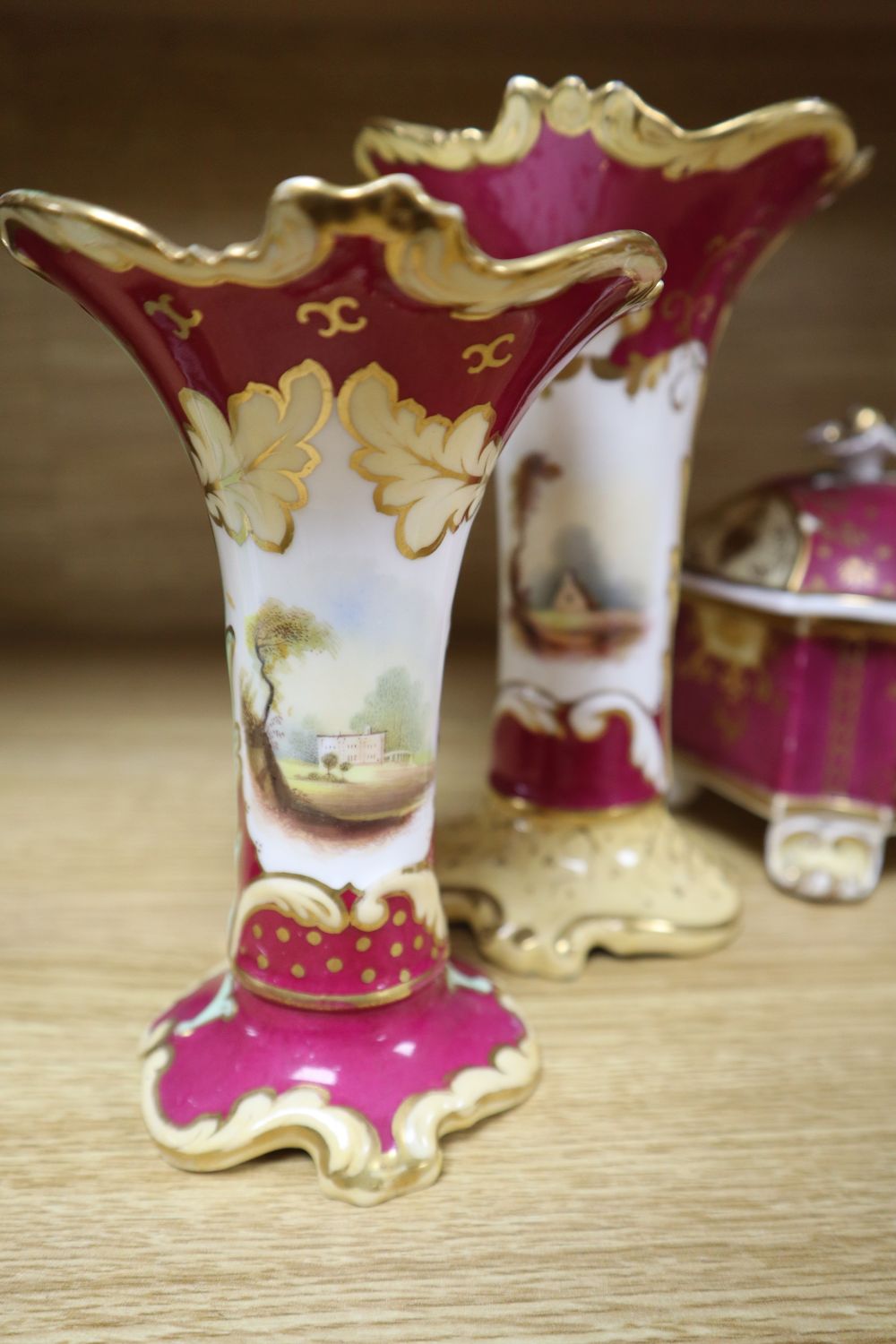 A group of English porcelain ruby ground vessels, c. 1825-45,